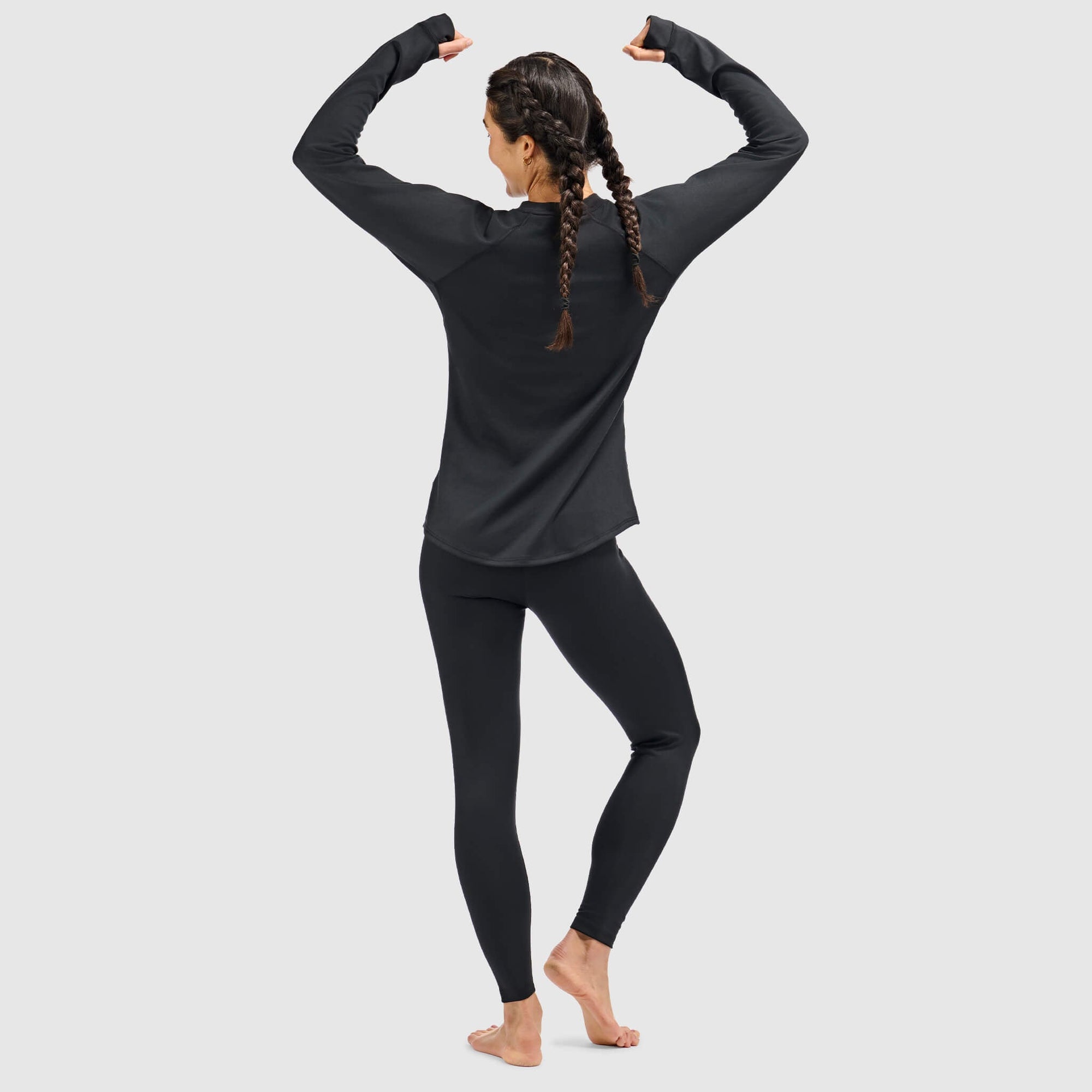 Women's long-sleeve crewneck base layer top, back view, with matching leggings