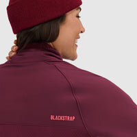Burgundy fleece pullover jacket with half zip and beanie, back view showing brand logo