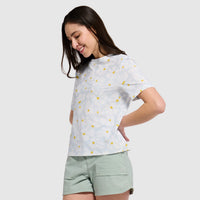 White short-sleeve tee with colorful polka dot pattern worn by woman