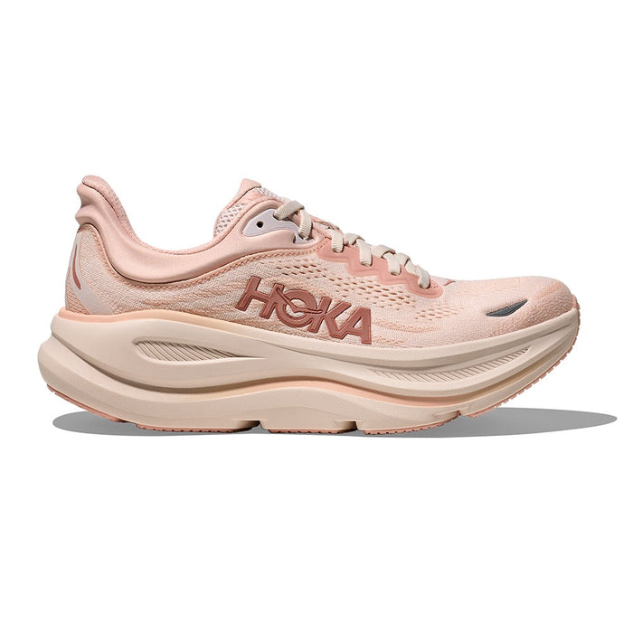 Light pink running shoe with thick cushioned sole, side profile view on white background