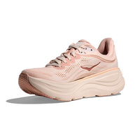 Light pink running shoe with thick sole and mesh upper, side view