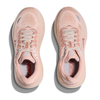 Light pink athletic running shoes with mesh upper and lace-up closure, top-down view