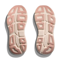 Pink and cream athletic shoe soles showing textured tread pattern and grip zones