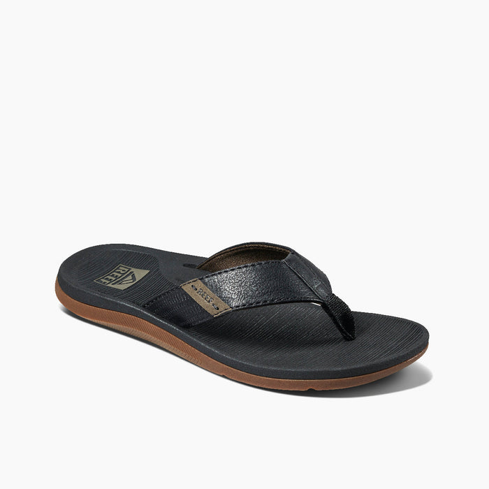 Black flip-flop sandal with textured footbed and brown rubber sole, side angle view