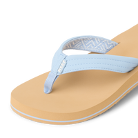 Light blue flip-flop sandal with cushioned sole and patterned strap detail, angled view