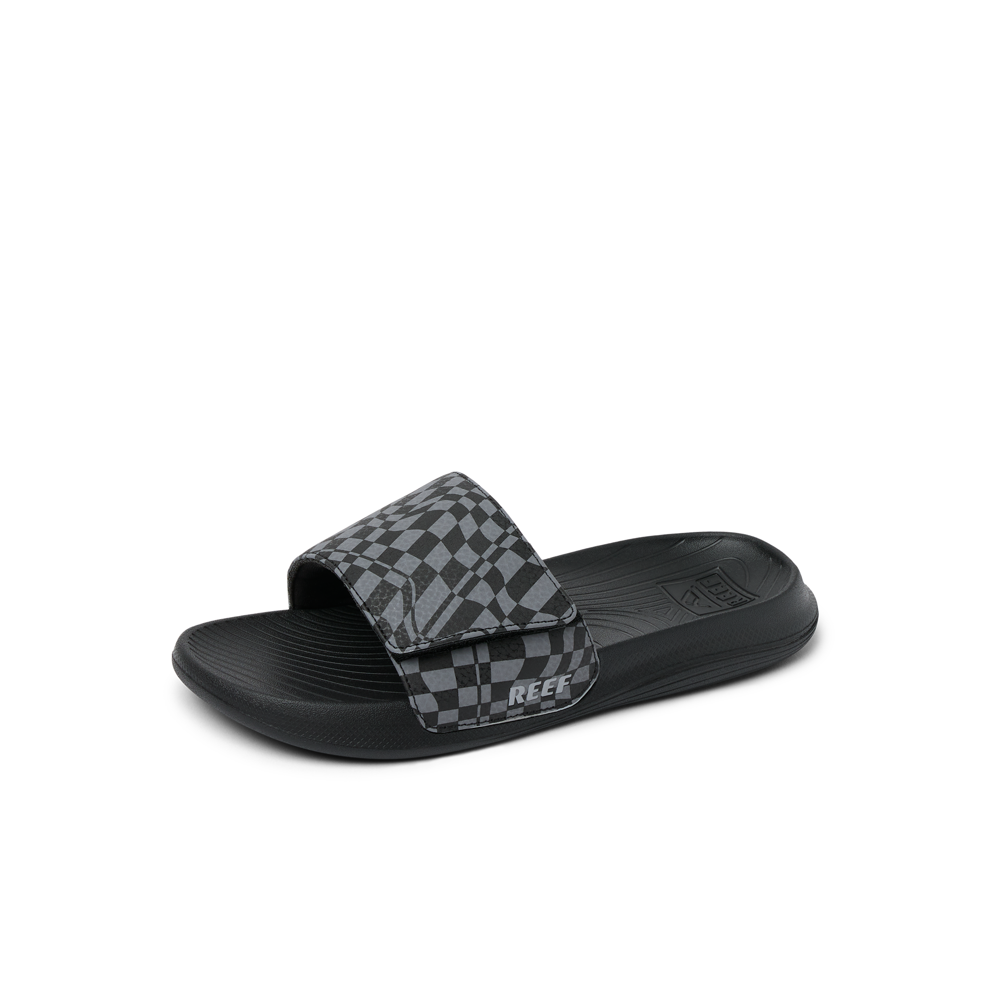 Black slide sandal with gray and black checkered pattern strap, side view
