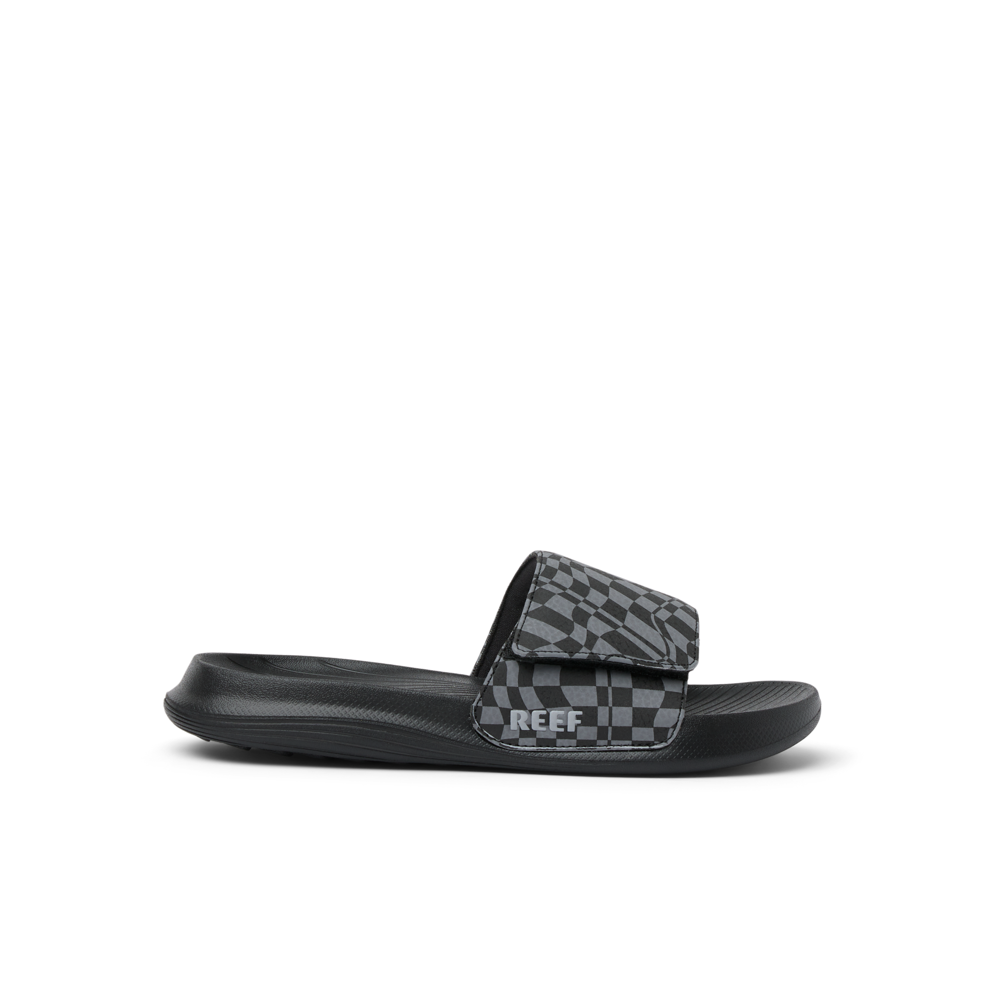 Black slide sandal with gray checkered pattern strap, side profile view