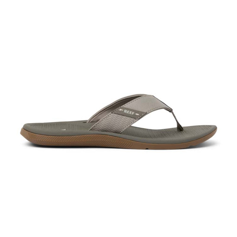 Gray flip-flop sandal with textured strap and brown rubber sole, side profile view