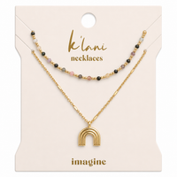 Two-piece necklace set with multicolor beaded strand and gold rainbow arch pendant on display card