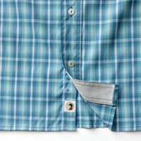 Blue plaid long sleeve shirt with chest pocket and white buttons, detail view