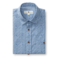 Light blue chambray short sleeve shirt with small repeating pattern and brown buttons