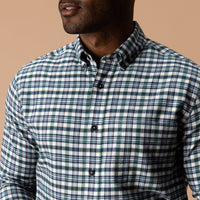 Men's plaid flannel button-down shirt with button-down collar, close-up front view on model