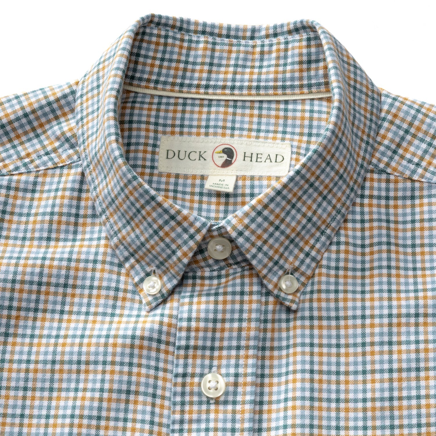 Men's button-down collar plaid sport shirt with amber, teal, and blue checks, flat lay view
