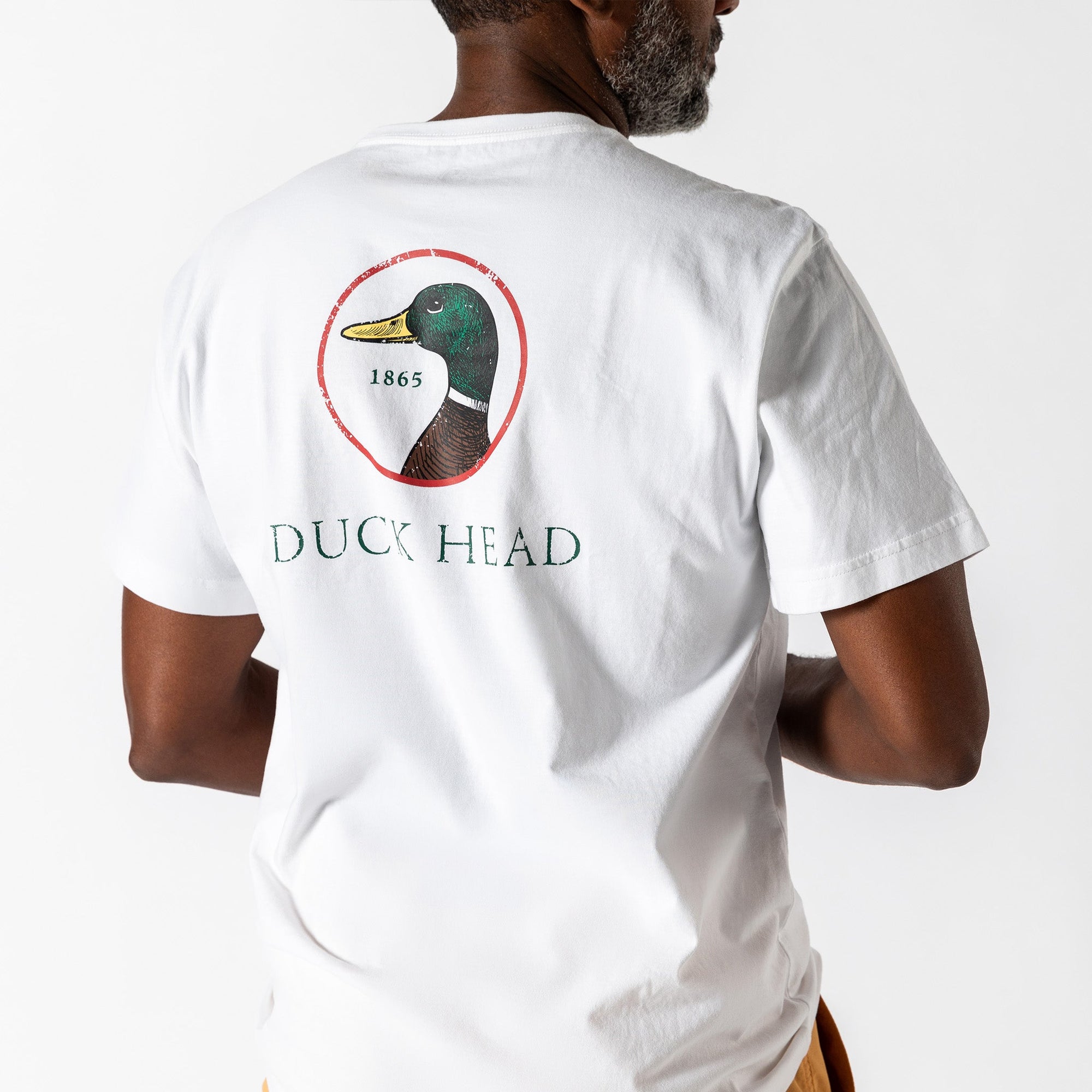 White short sleeve t-shirt with duck head logo on back, shown from behind