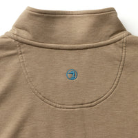 Tan quarter-zip pullover with embroidered logo detail on chest, close-up view