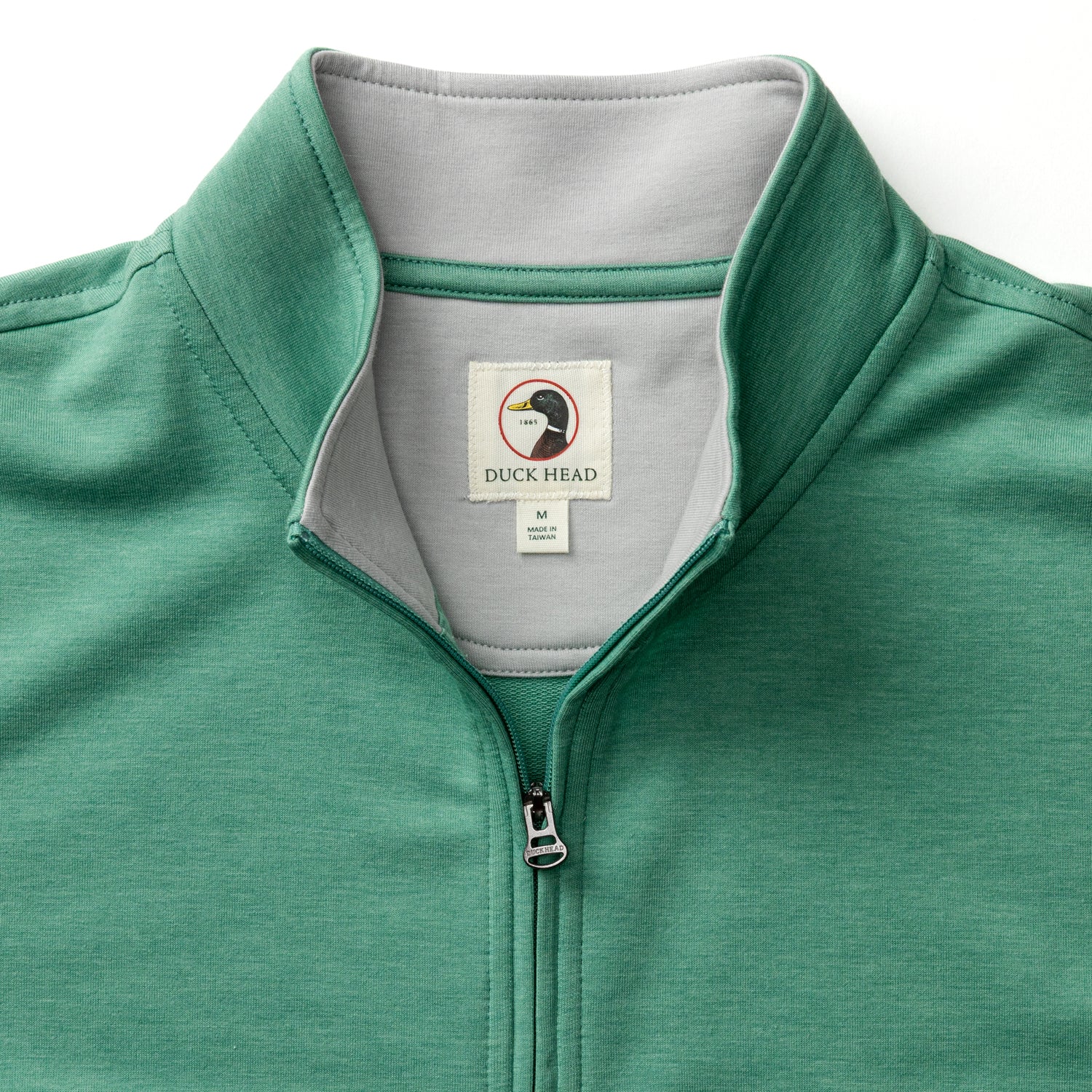 Green heather quarter-zip pullover with collar detail and zipper, partial front view