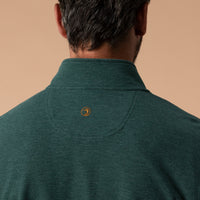 Back view of men's quarter-zip pullover showing collar, loop detail, and circular logo patch