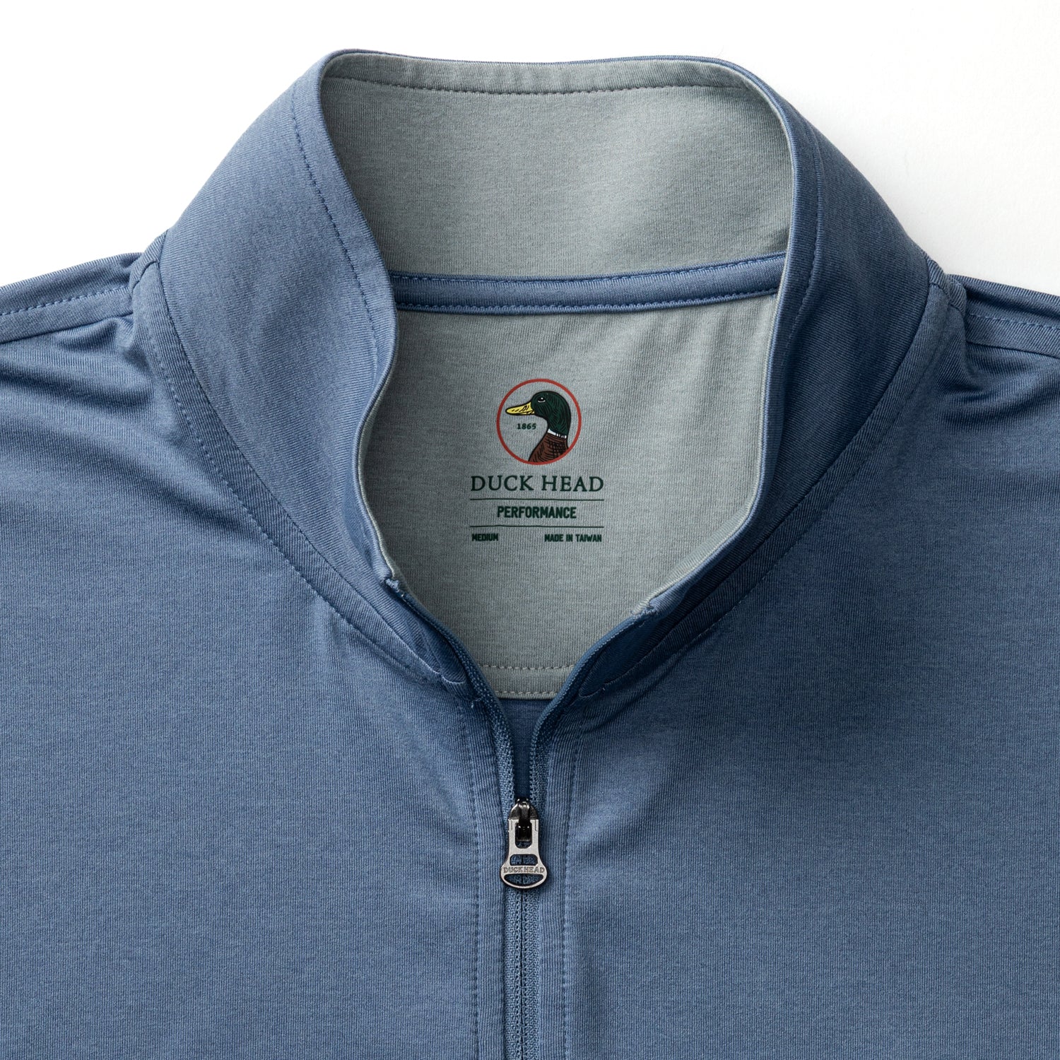 Men's quarter-zip pullover in blue with performance fabric, collar detail shown