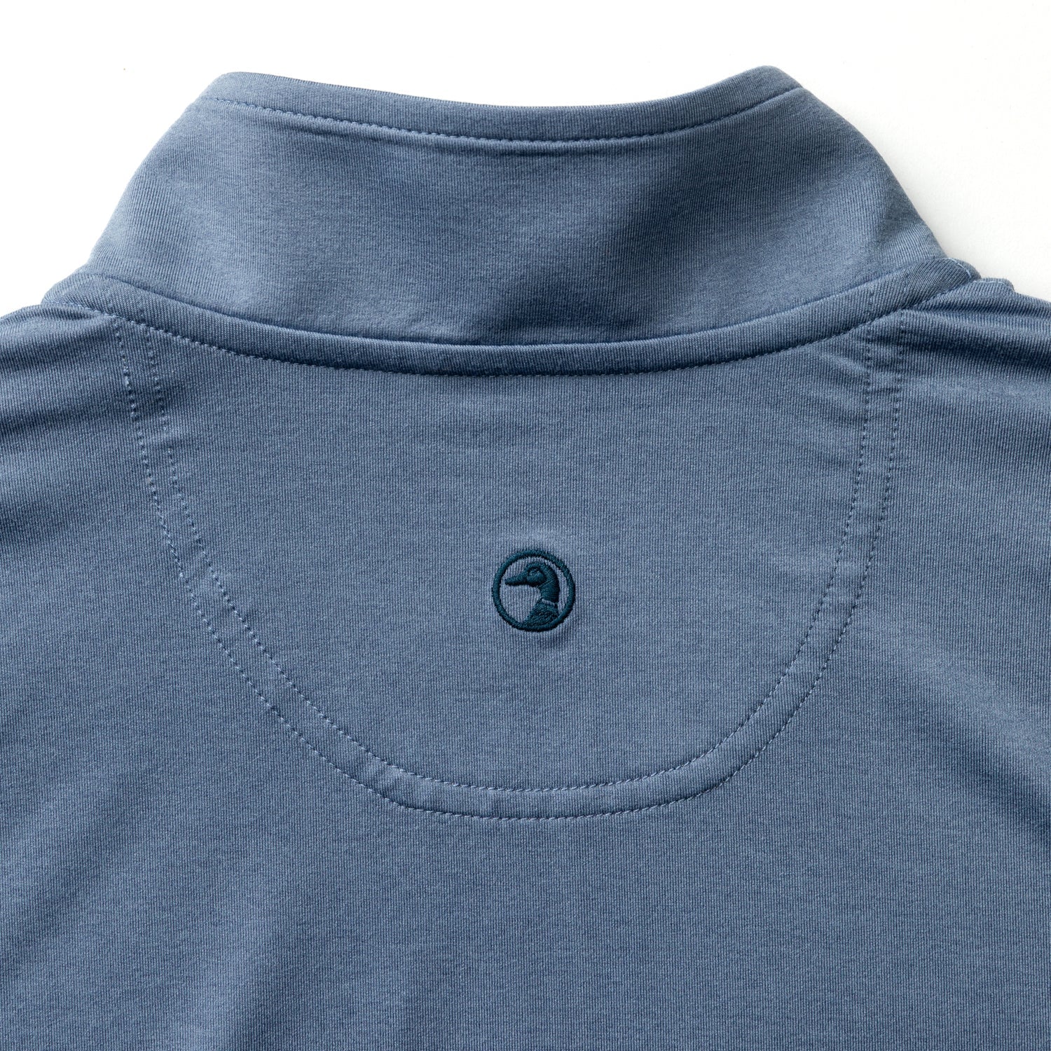 Blue-gray quarter zip pullover detail showing collar, zipper and back yoke construction