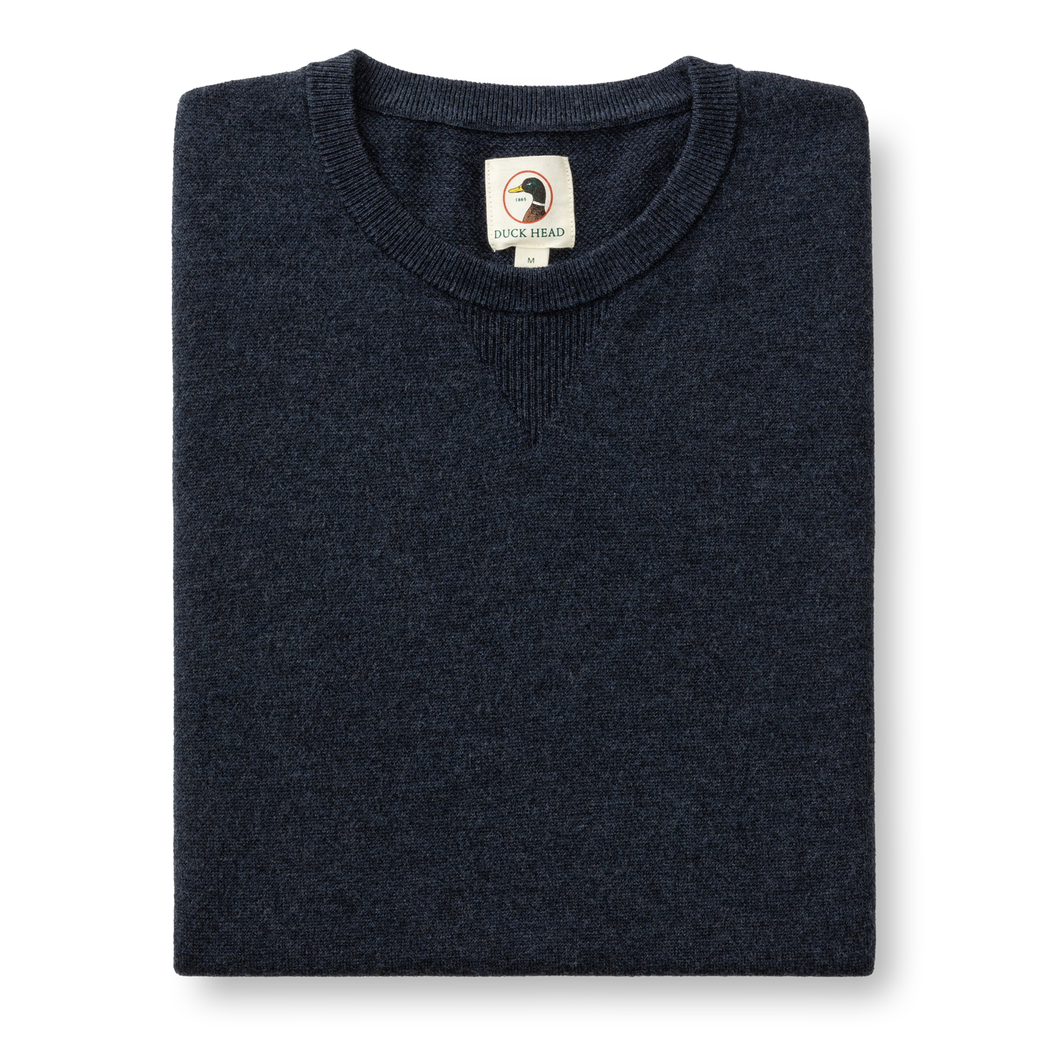 Folded dark navy merino wool crewneck sweater with ribbed collar, front view