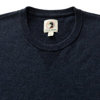 Dark navy heathered merino crewneck sweater, close-up of collar and label detail