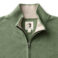 Sage green quarter-zip sweater with ribbed collar and textured knit fabric, front view