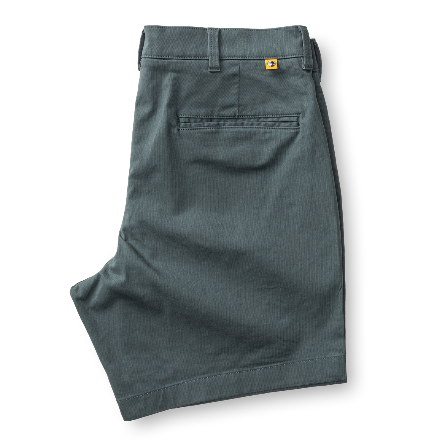 Men's chino shorts in sage green color, folded to show back waistband and pocket details