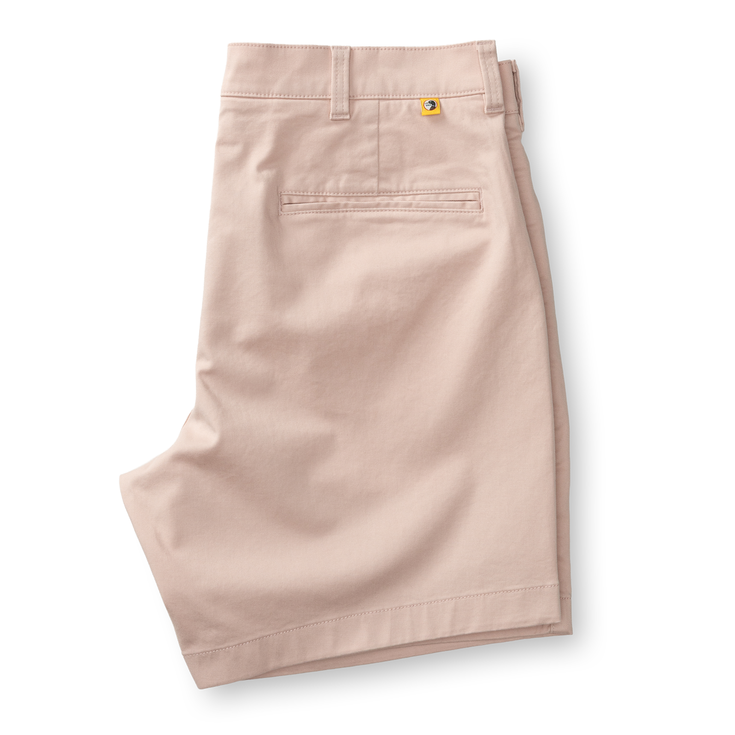 Light pink chino shorts with flat front styling and back pocket detail