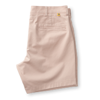 Light pink chino shorts with flat front styling and back pocket detail