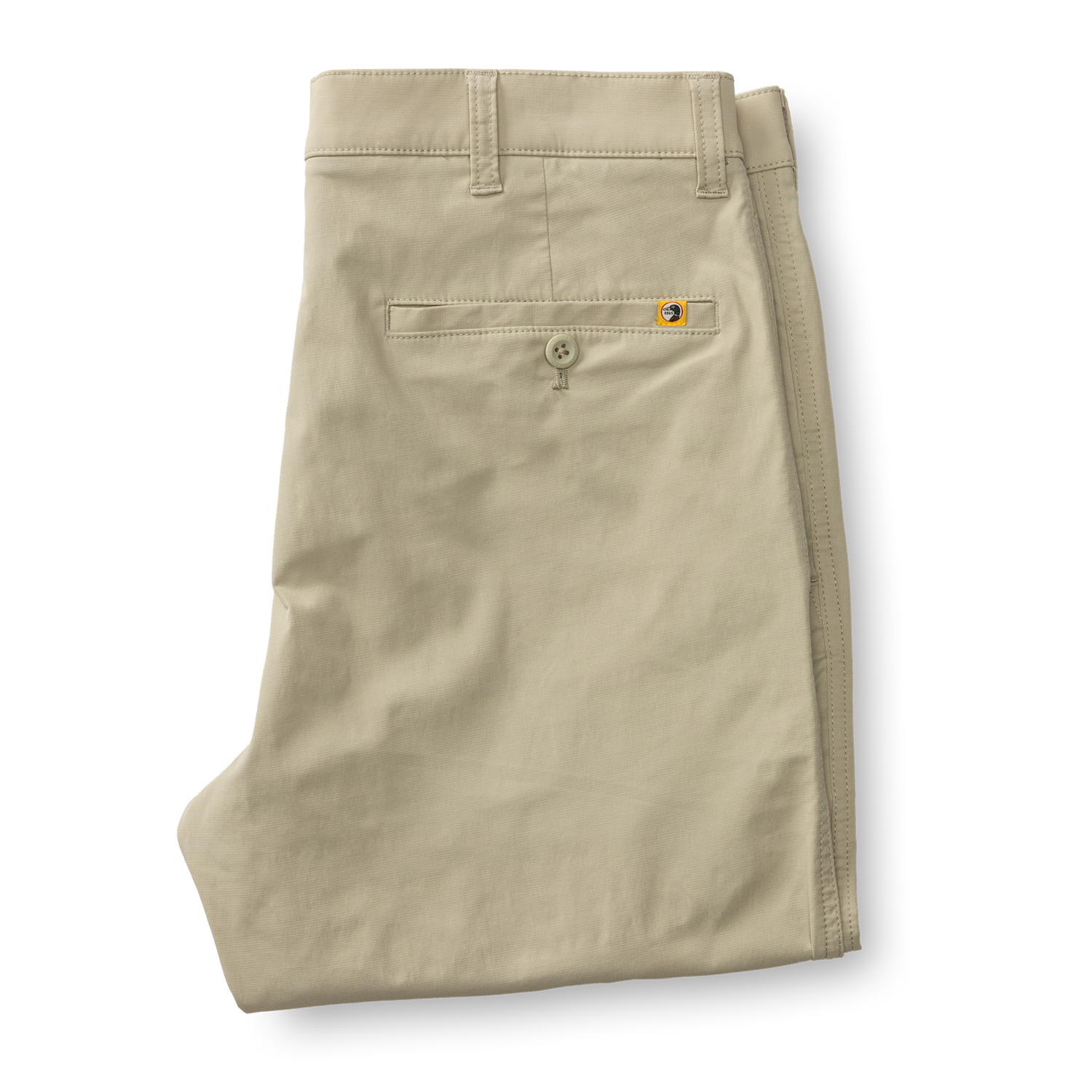 Light beige chino pants folded showing back pockets and waistband details
