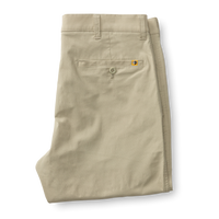 Light beige chino pants folded showing back pockets and waistband details
