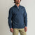 Navy blue quarter-zip pullover sweatshirt worn by male model, front view