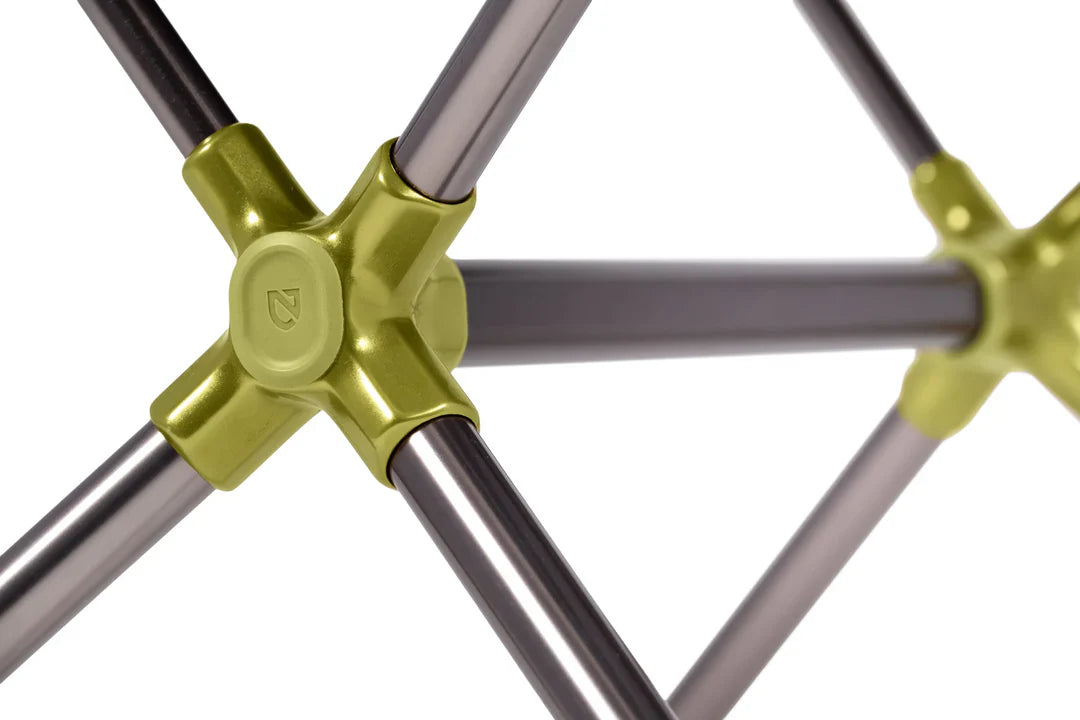 Close-up of folding chair frame with cross-shaped green hub connectors joining grey metal poles