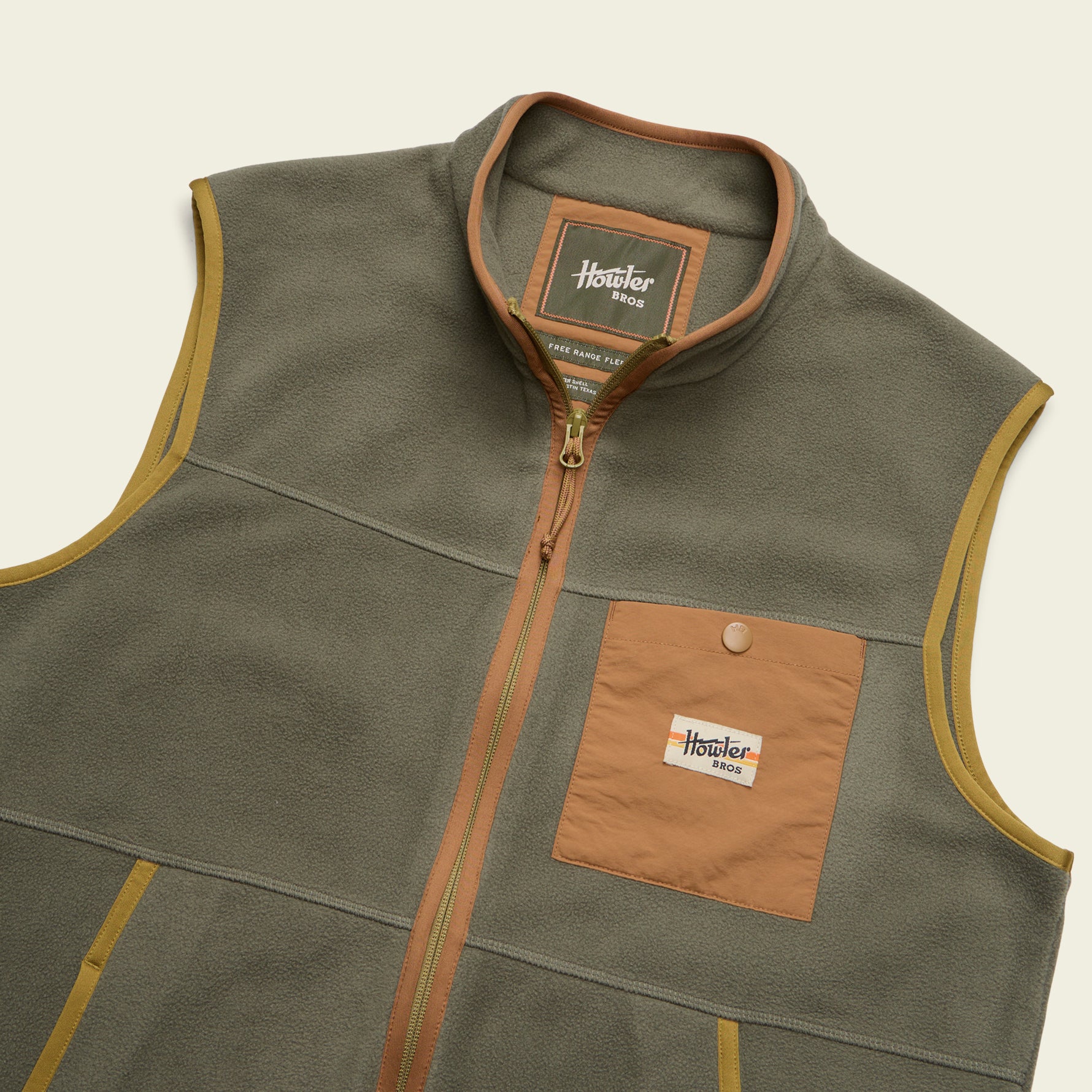 Olive green fleece vest with full zip, chest pocket, and contrasting tan trim, angled detail view