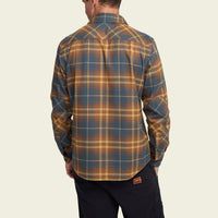 Men's long-sleeve plaid flannel shirt in brown and blue tartan, back view on model