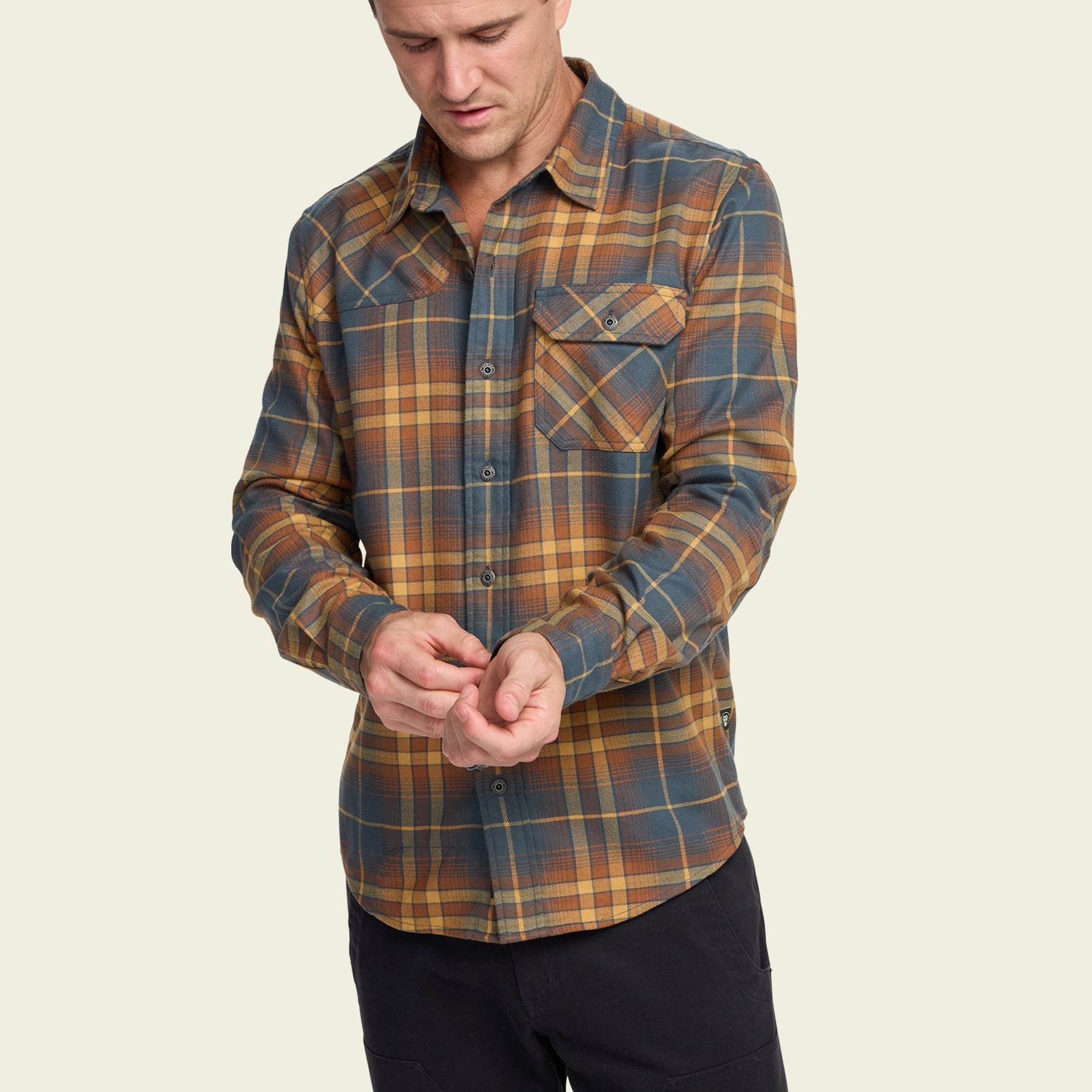 Men's long-sleeve plaid flannel shirt with chest pocket, front view on model