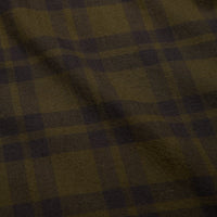 Close-up detail of lightweight flannel fabric showing olive and dark brown checkered plaid pattern