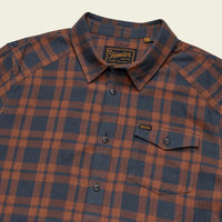 Men's plaid flannel shirt with chest pocket, button front, and spread collar, angled view