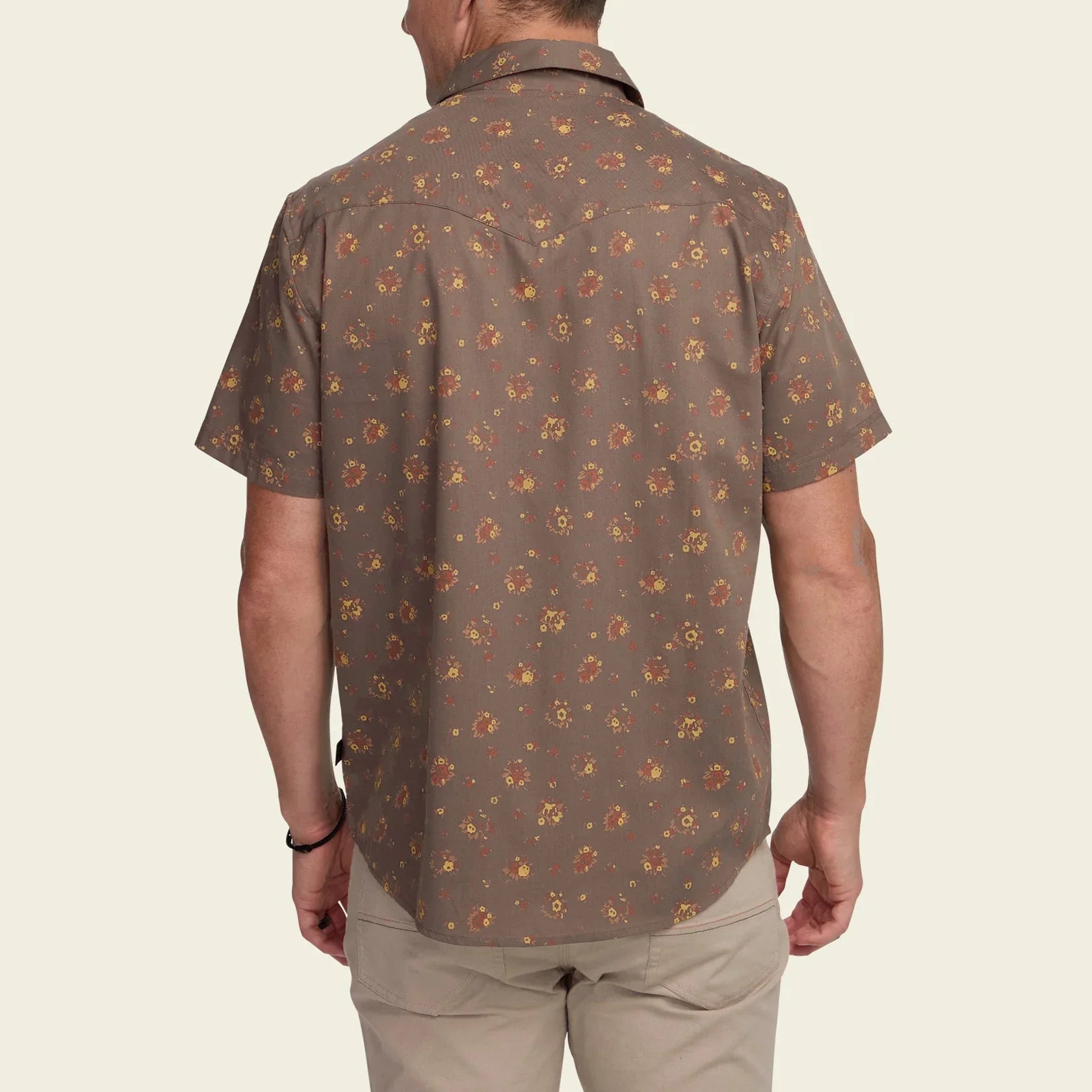 Men's short-sleeve floral print snap shirt, back view, worn with khaki pants