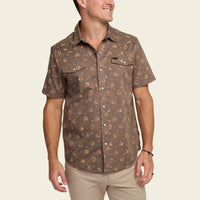 Men's short-sleeve snap-button shirt with floral print, dual chest pockets, front view on model
