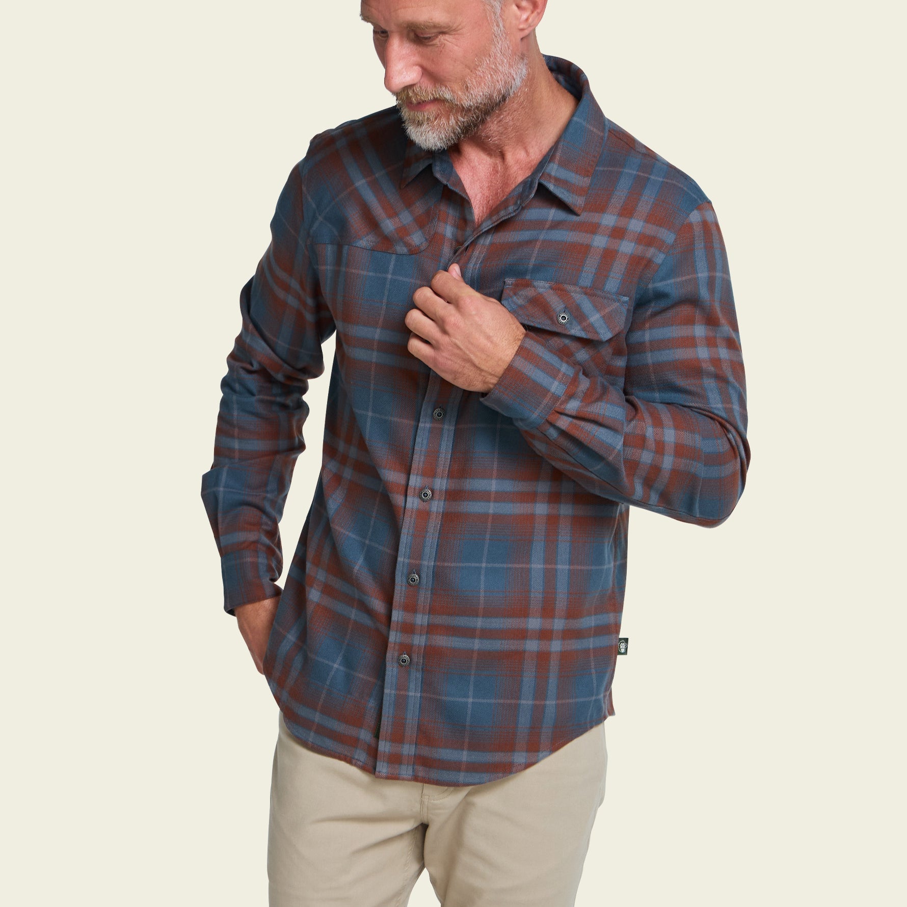 Men's long-sleeve plaid flannel shirt with chest pocket, front view on model