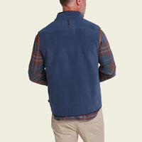 Men's fleece vest back view, worn over plaid flannel shirt with khaki pants