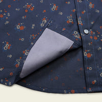 Close-up detail of floral print snap shirt pocket with contrast lining revealed