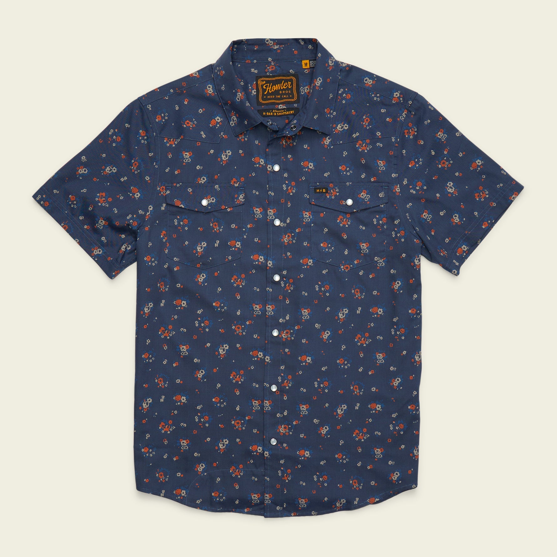 Men's short-sleeve snap-button shirt in navy with scattered floral print, flat front view