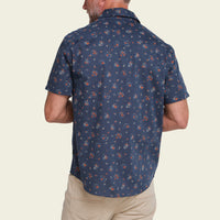Men's short-sleeve navy floral print button-up shirt, back view on model