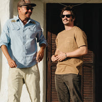 Men's tan short-sleeve t-shirt with chest pocket worn on model outdoors, lifestyle shot