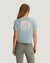 Light blue cropped t-shirt with circular sun and wave graphic on back, rear view