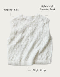 White crochet knit sleeveless sweater tank with slight crop and ribbed trim, flat lay view