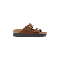 Brown suede platform sandals with dual adjustable buckle straps and cork sole, side view