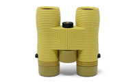 Yellow-green compact binoculars with ribbed rubber grip and central focus wheel, front view